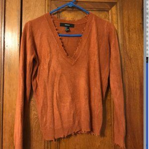 Distressed burnt orange sweater